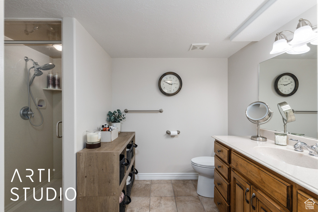 Bathroom featuring vanity and a stall shower