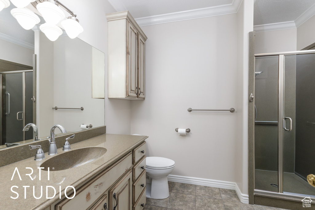 Full bathroom with crown molding, vanity, and a shower stall