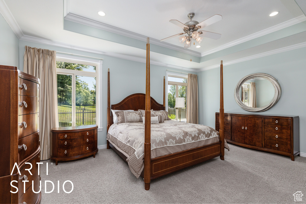 Bedroom with carpet, a raised ceiling, crown molding, a ceiling fan, and recessed lighting