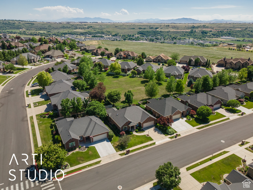 Aerial view of residential area featuring a mountain backdrop