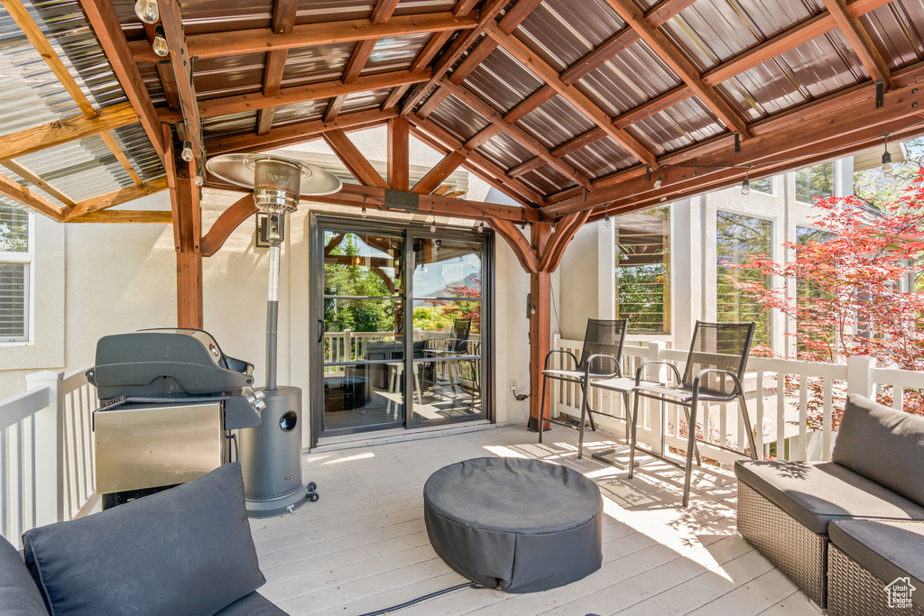 Deck featuring a gazebo and a grill