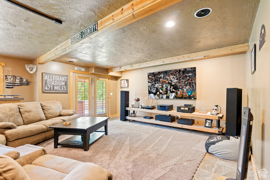 Carpeted living room with recessed lighting