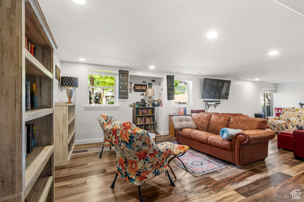 Living room with wood finished floors and recessed lighting
