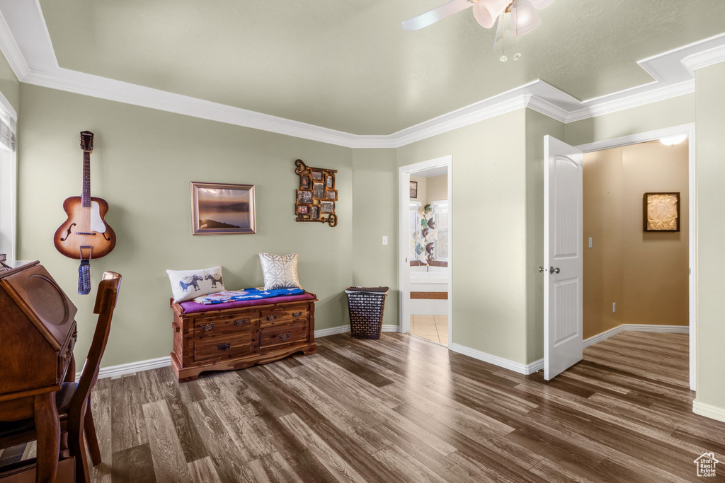Office with wood finished floors, ornamental molding, and a ceiling fan