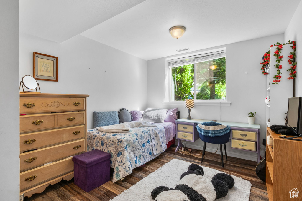 Bedroom with wood finished floors