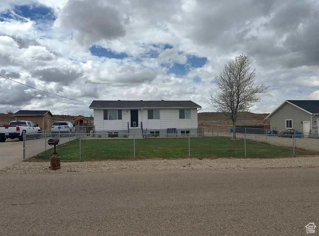 Single story home with a fenced front yard