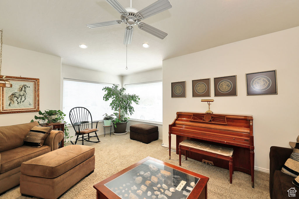 Sitting room with a ceiling fan, carpet floors, and recessed lighting