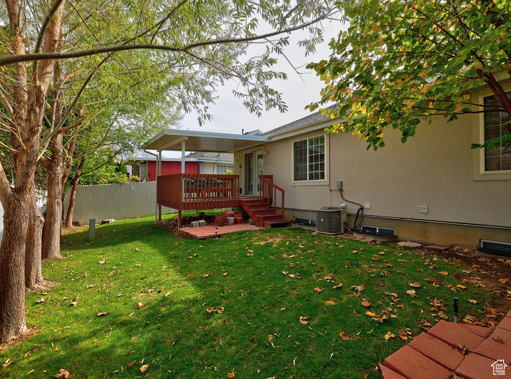 View of yard featuring a wooden deck