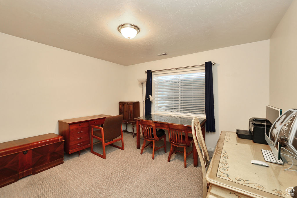 Office with light colored carpet