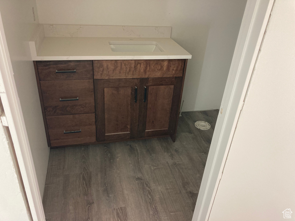 Bathroom featuring vanity and wood finished floors
