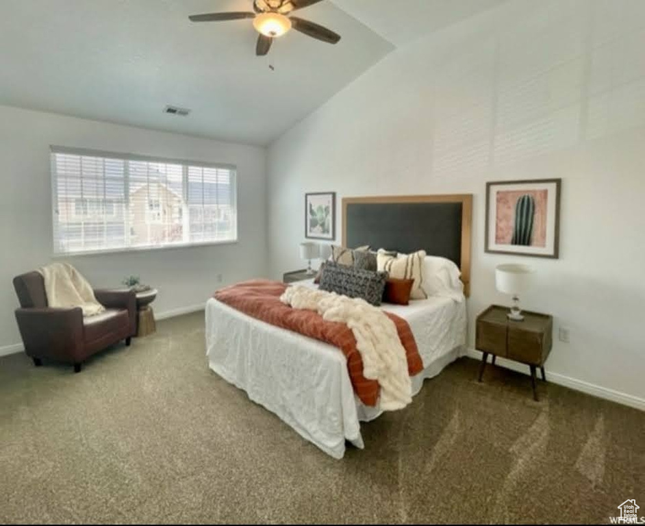 Bedroom with carpet, vaulted ceiling, and ceiling fan
