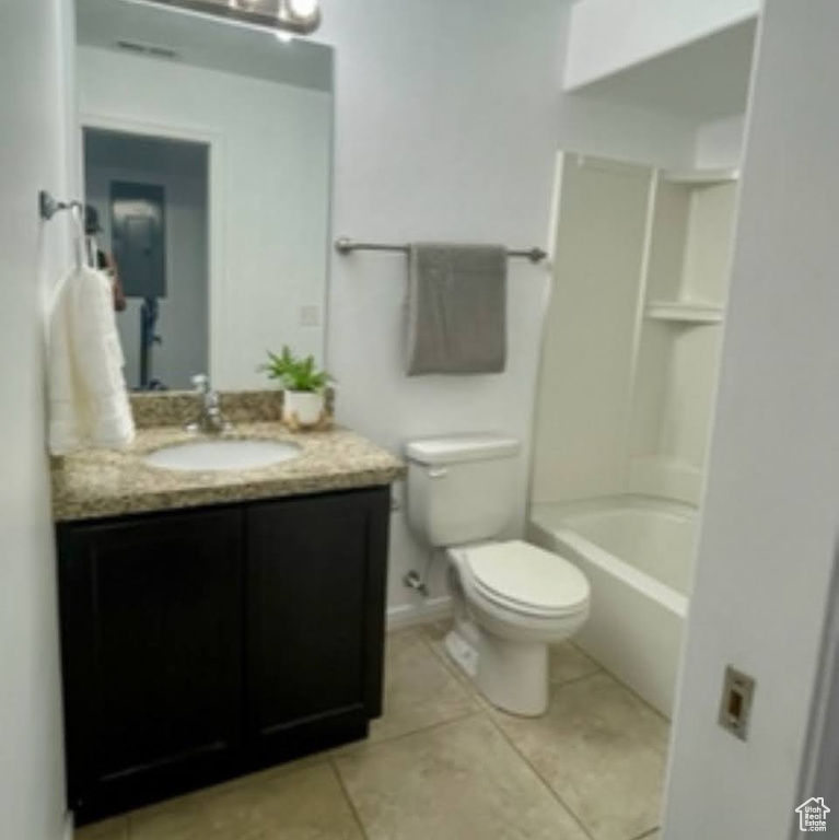 Full bath with vanity, tile patterned flooring, and bathing tub / shower combination