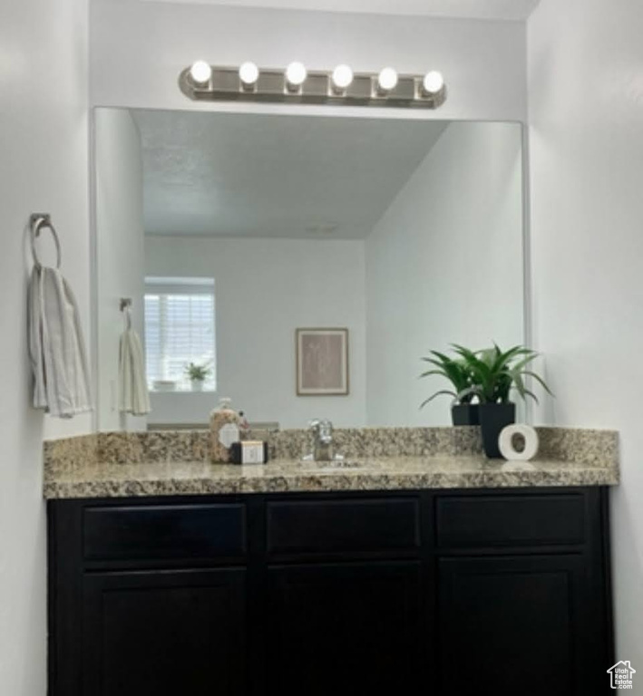 Full bath featuring vanity