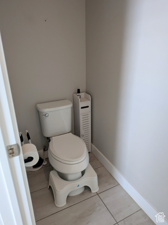 Bathroom with tile patterned flooring