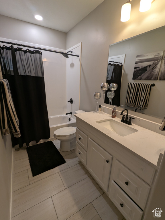 Bathroom with vanity, shower / bath combination with curtain, and recessed lighting