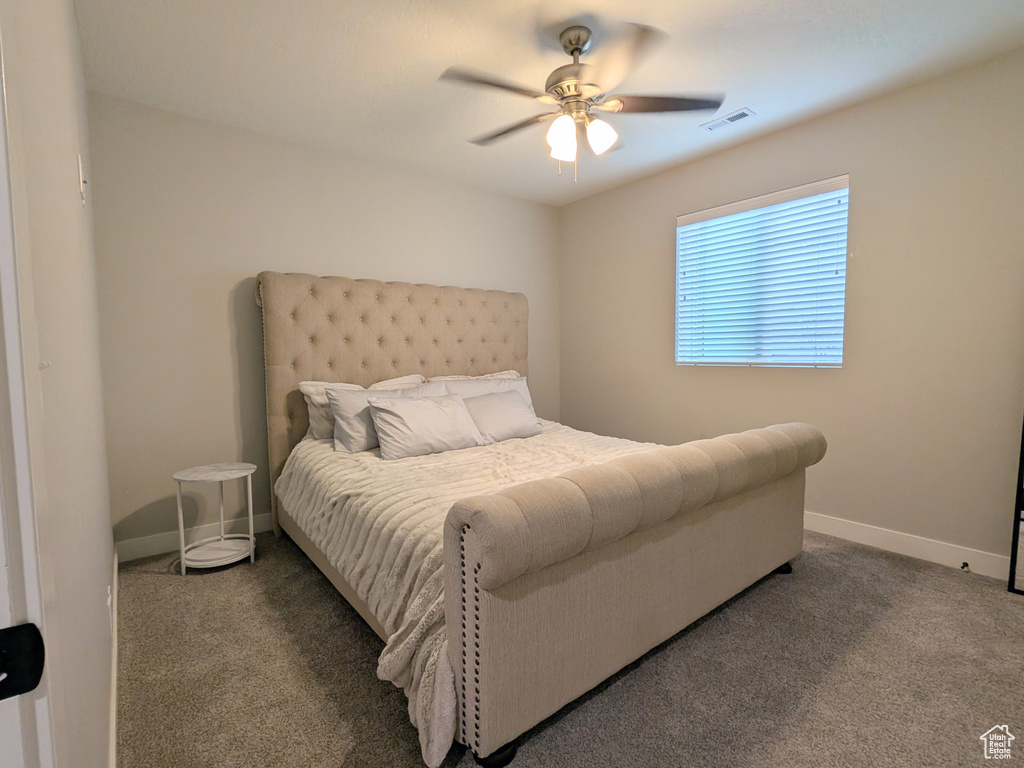 Bedroom featuring carpet and ceiling fan