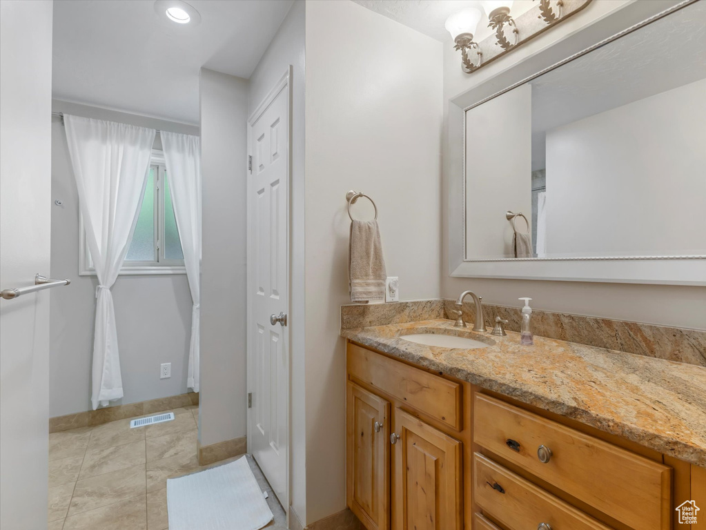 Bathroom featuring vanity, recessed lighting, and tile patterned floors