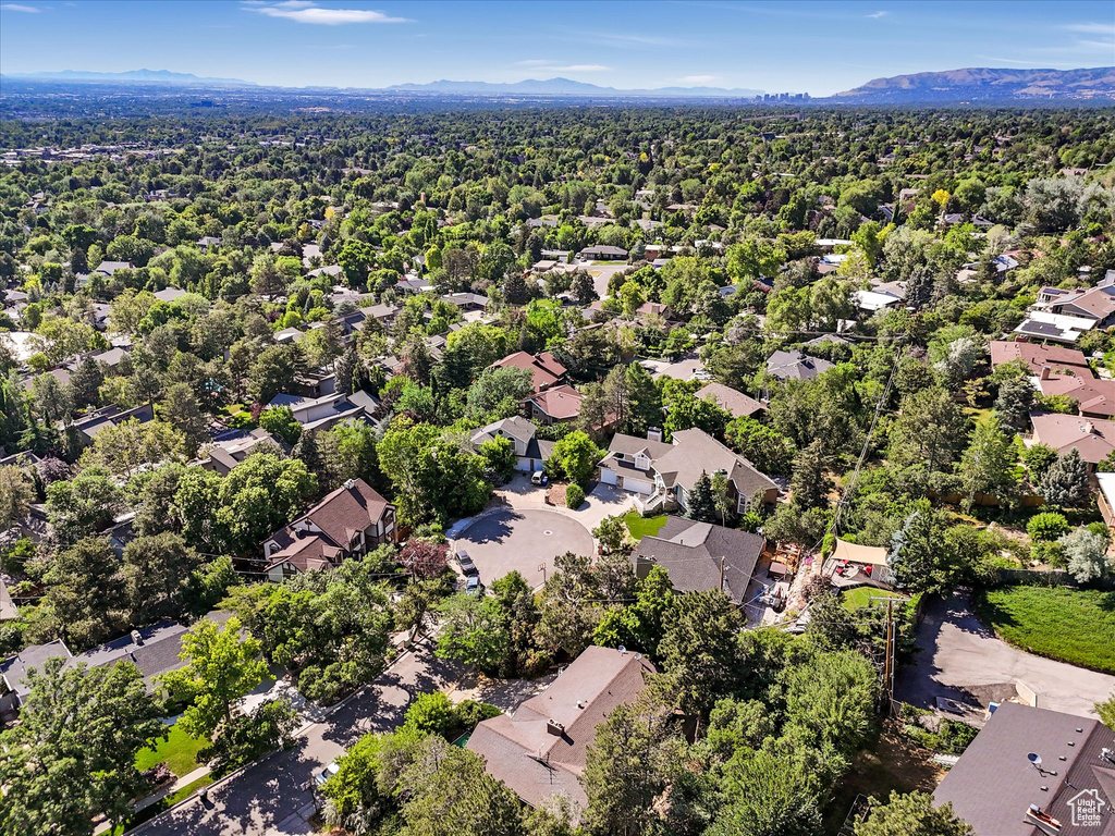 Aerial view of residential area featuring a mountain backdrop