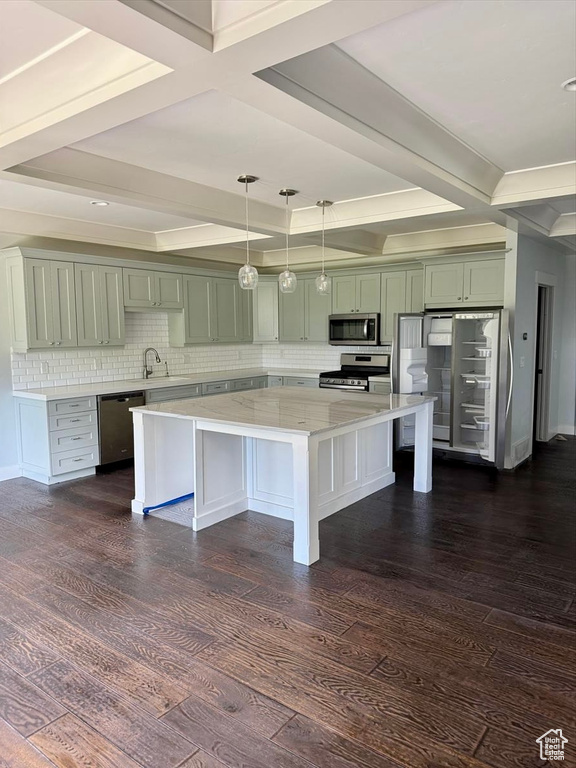 Kitchen featuring stainless steel appliances, coffered ceiling, a center island, backsplash, and dark wood finished floors