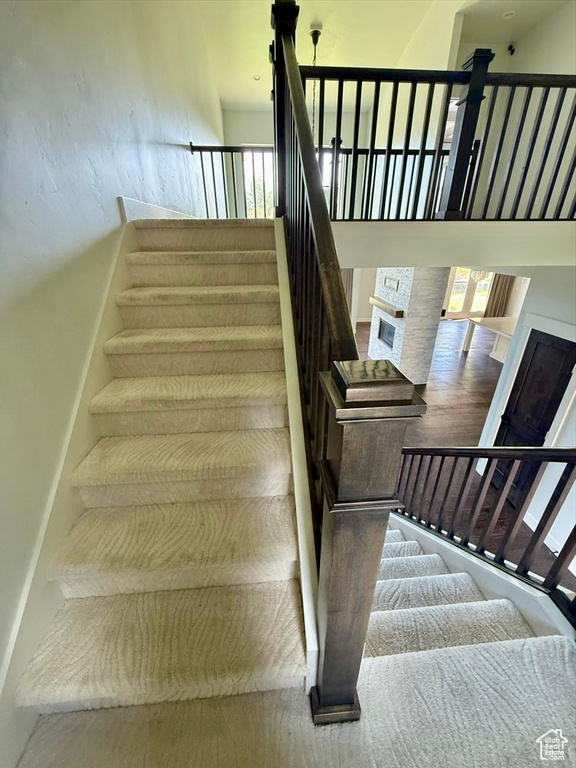 Stairway featuring a high ceiling