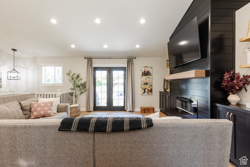 Living area with a glass covered fireplace and recessed lighting