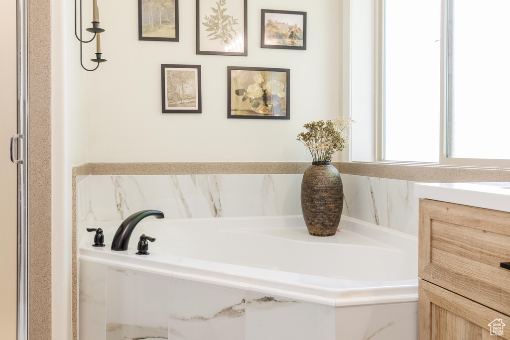 Full bathroom featuring a bath