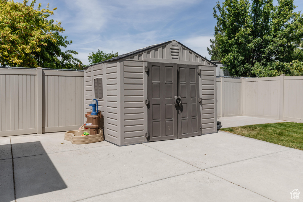 View of shed featuring a fenced backyard