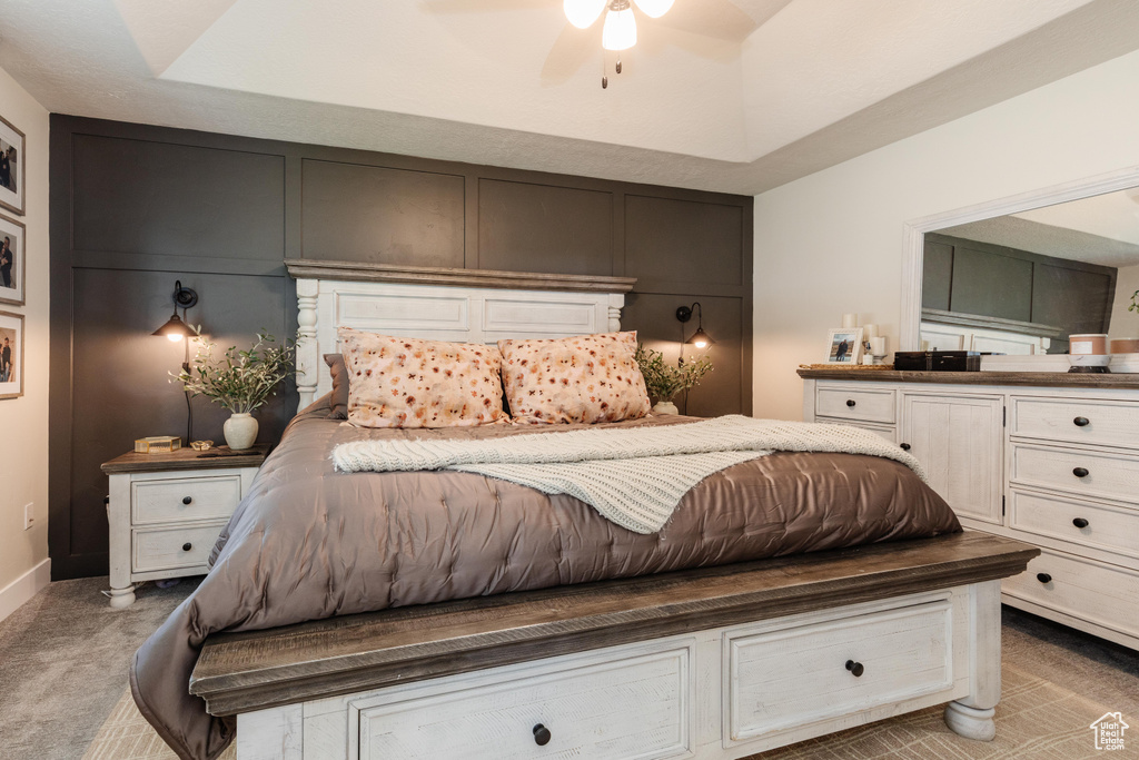 Bedroom featuring a decorative wall