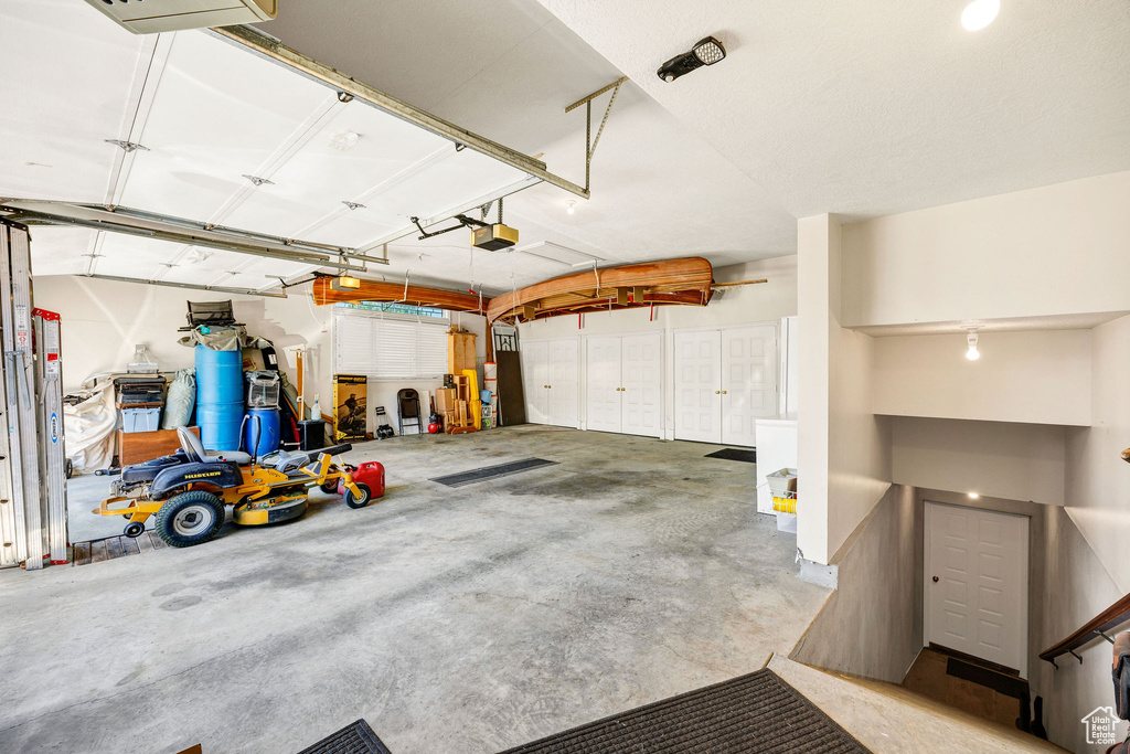 Garage featuring a garage door opener