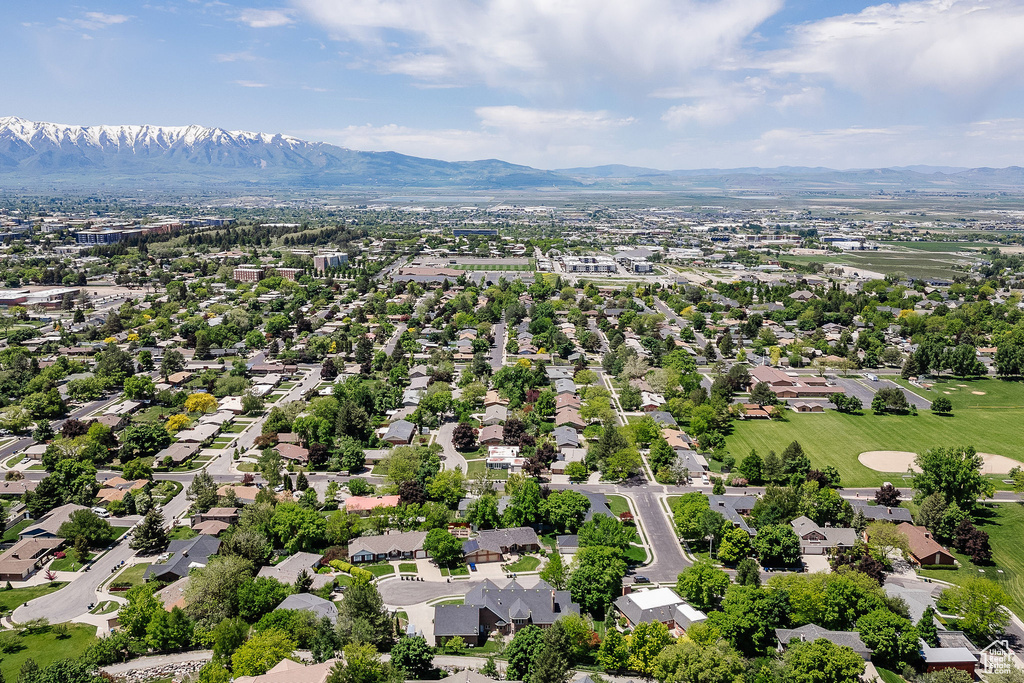 Aerial perspective of suburban area with a mountain backdrop
