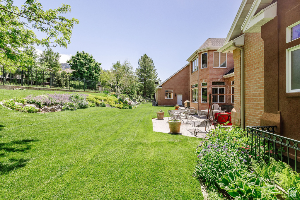 View of yard with a patio area
