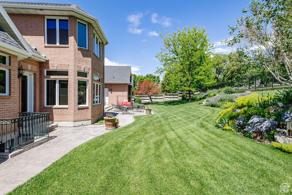 Fenced yard with a patio