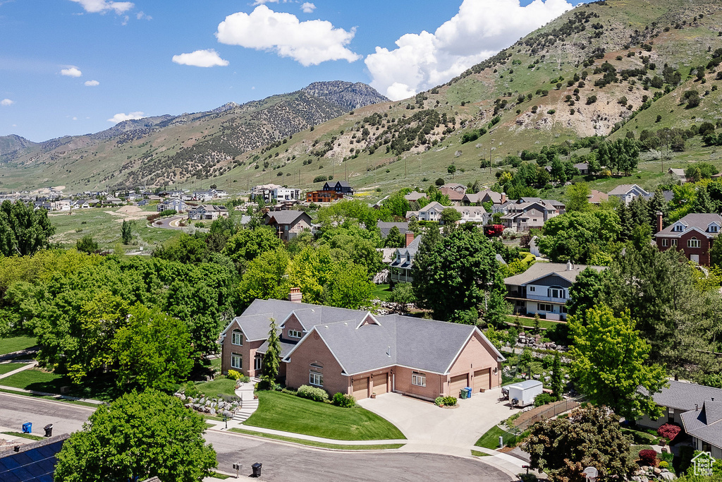 Aerial perspective of suburban area with a mountainous background