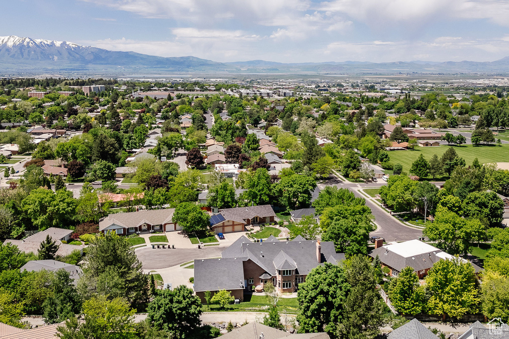 Aerial view of residential area with a mountain backdrop