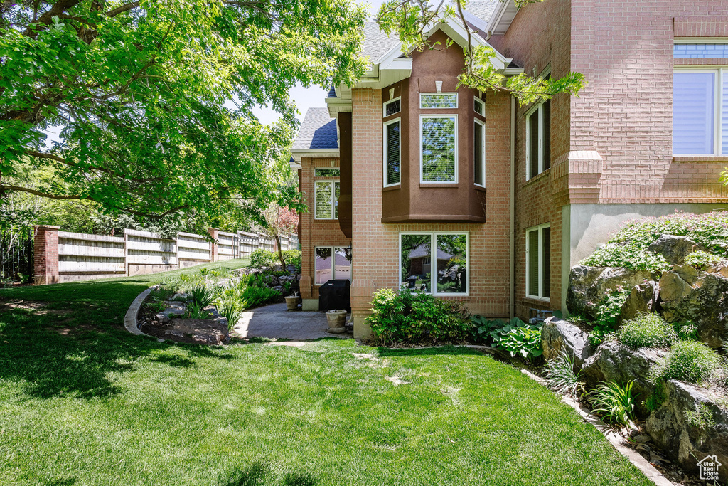 Rear view of house featuring brick siding