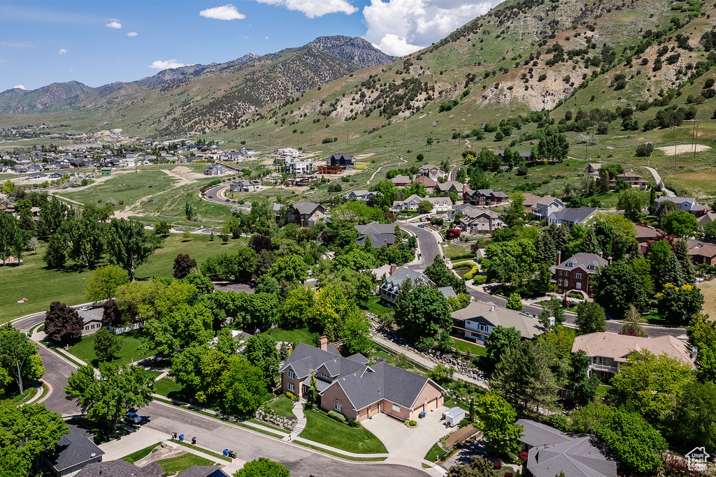 Aerial view of property\'s location with nearby suburban area and mountains