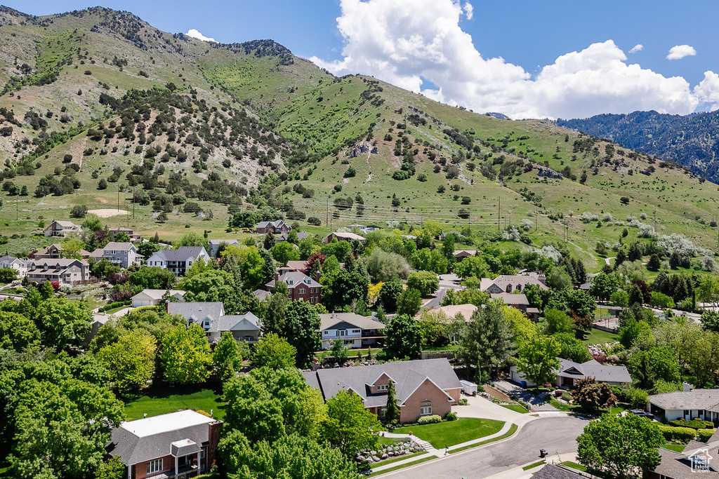 Aerial perspective of suburban area featuring a mountainous background