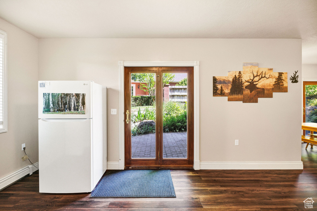 Entryway featuring a baseboard radiator and wood finished floors