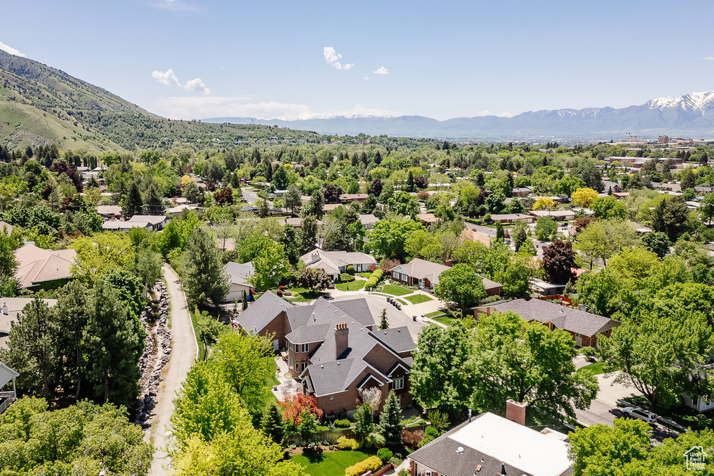 Aerial view of residential area featuring mountains