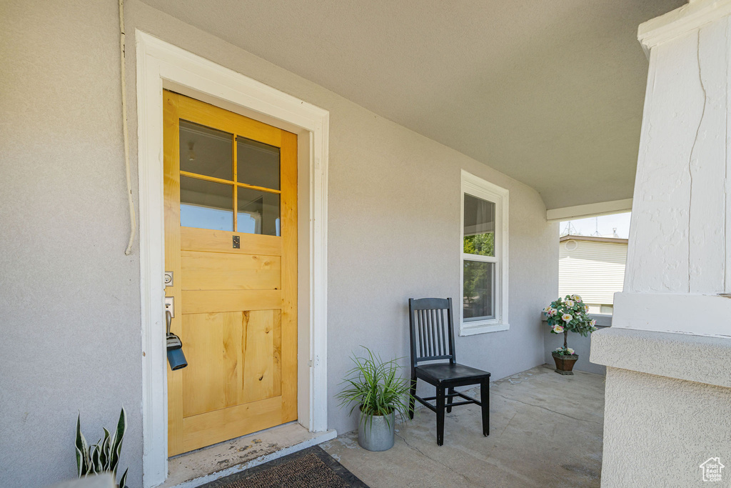 Property entrance featuring stucco siding