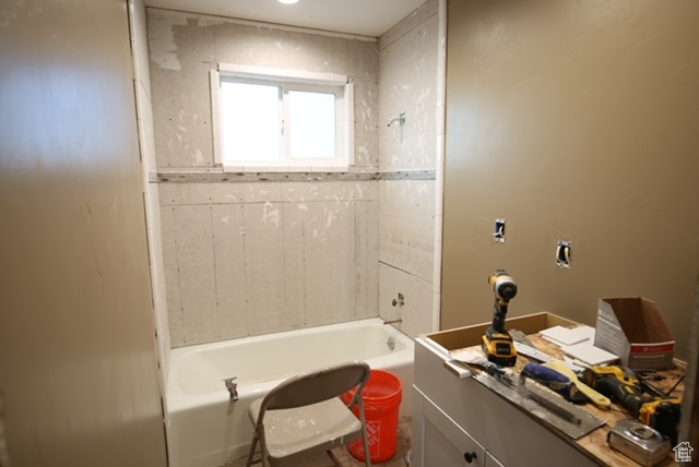 Bathroom with vanity and shower / bathtub combination