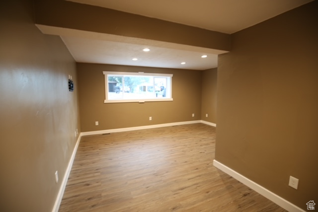 Spare room featuring light wood finished floors and recessed lighting