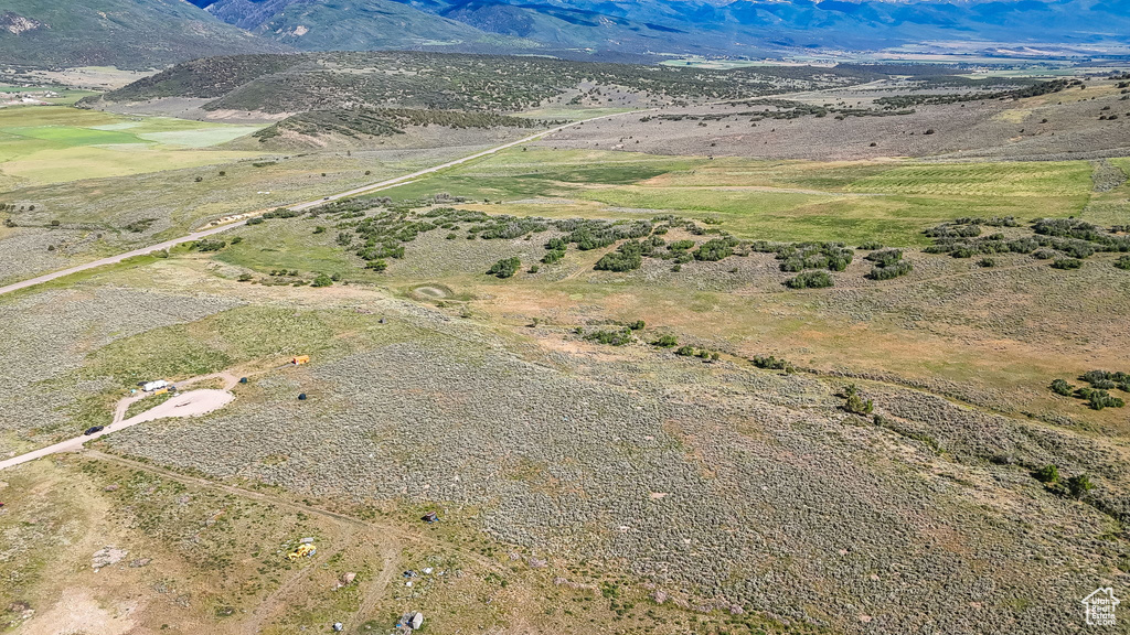 Overview of rural landscape featuring a mountain backdrop