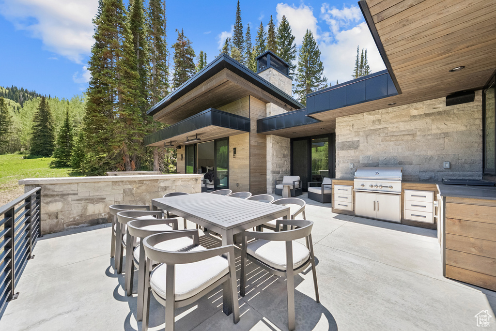 View of patio featuring an outdoor kitchen and outdoor dining space