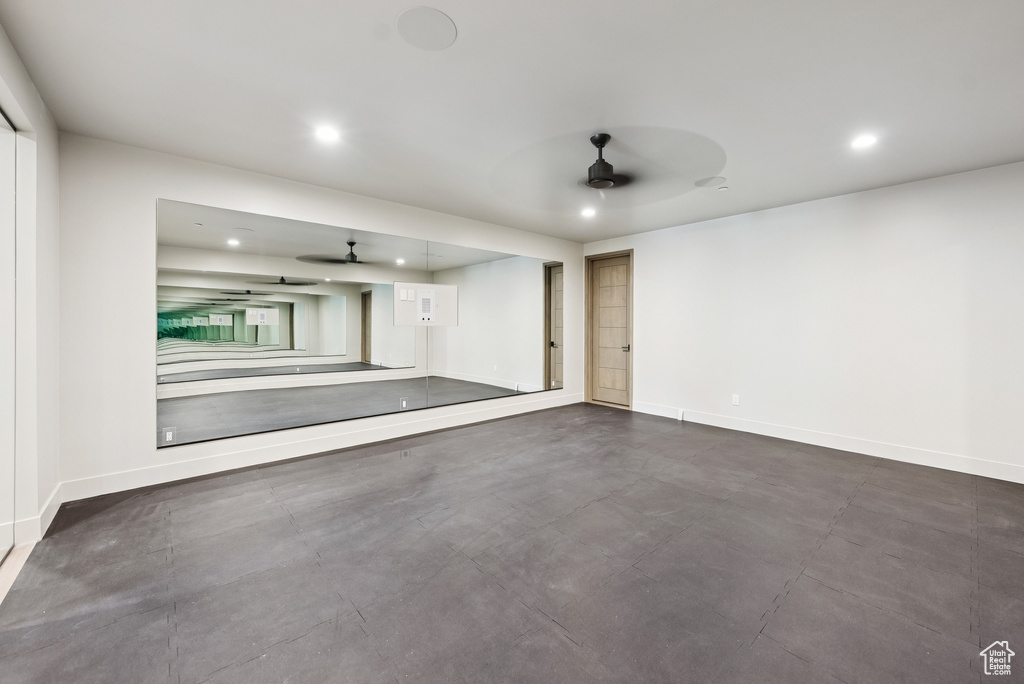 Garage with a ceiling fan and recessed lighting