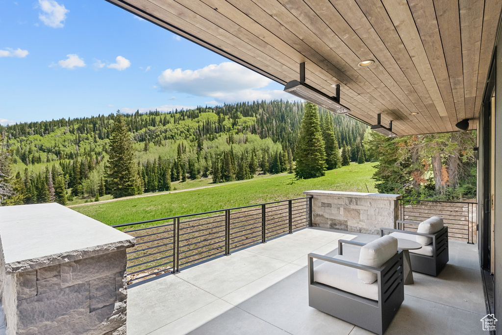 View of patio / terrace featuring a view of trees