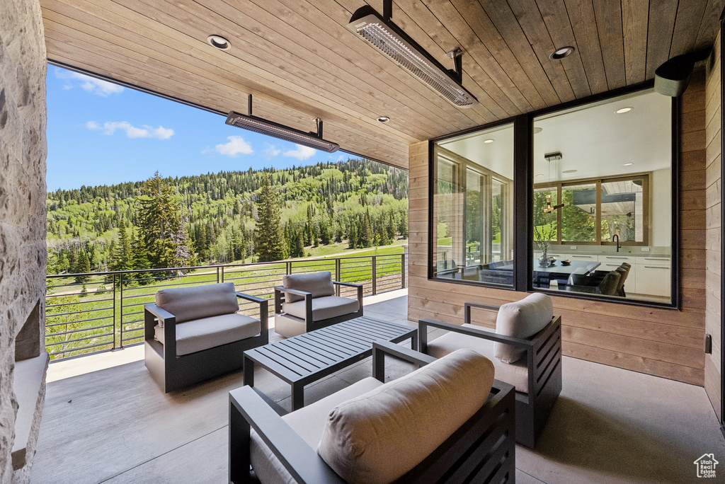 View of patio / terrace featuring a forest view and an outdoor hangout area