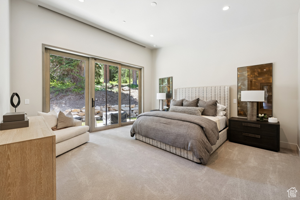 Bedroom with access to outside, carpet floors, and recessed lighting
