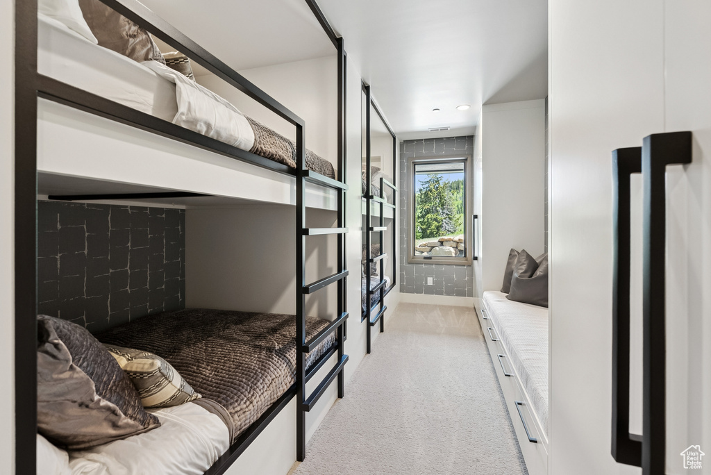 Bedroom with light colored carpet