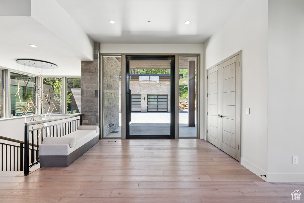 Foyer entrance with hardwood / wood-style floors and recessed lighting